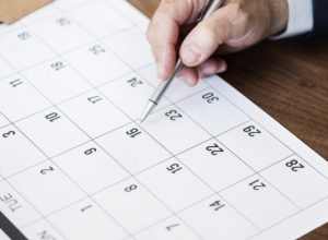 Businessman marking on calendar for an appointment